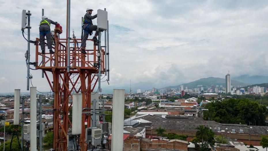 Workers inspecting 5G antennas