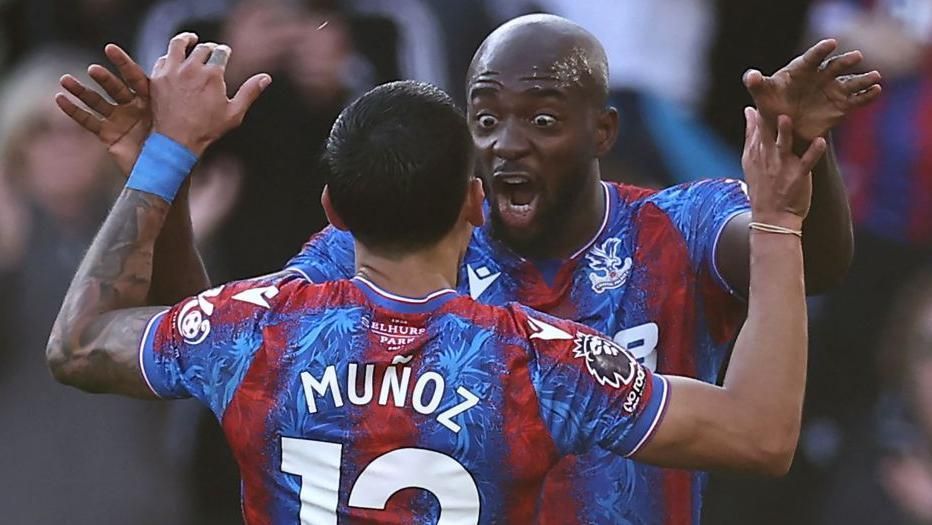 Crystal Palace striker Jean-Philippe Mateta celebrates with Daniel Munoz