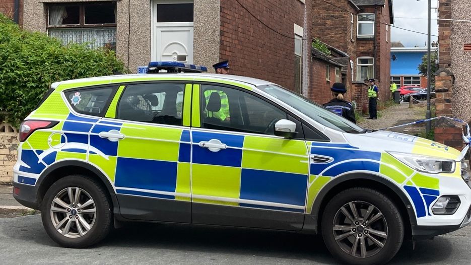 Police in the alleyway in Buccleuch Road in Normacot