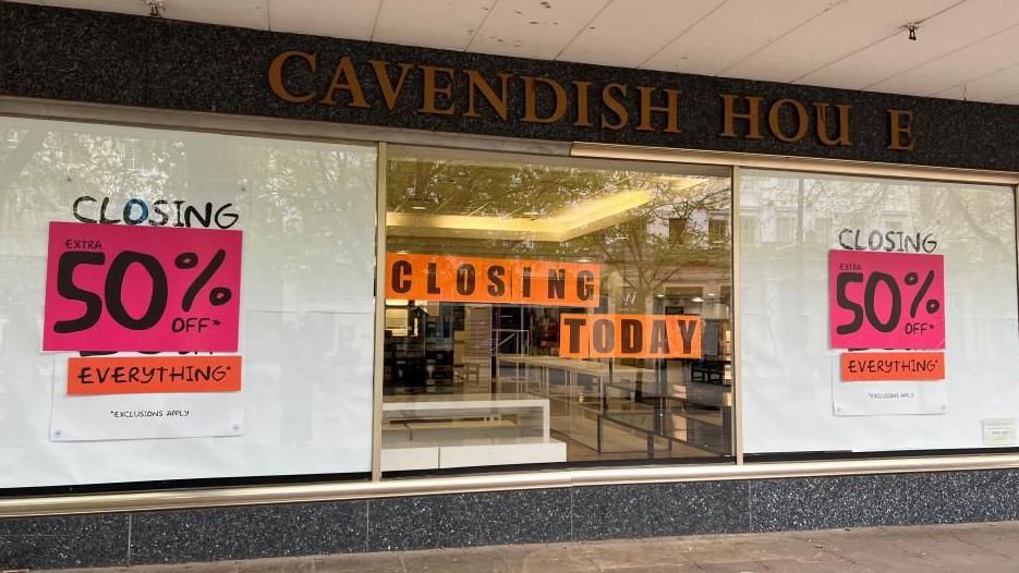 Exterior view of Cavendish House with "closing today" signs in the window
