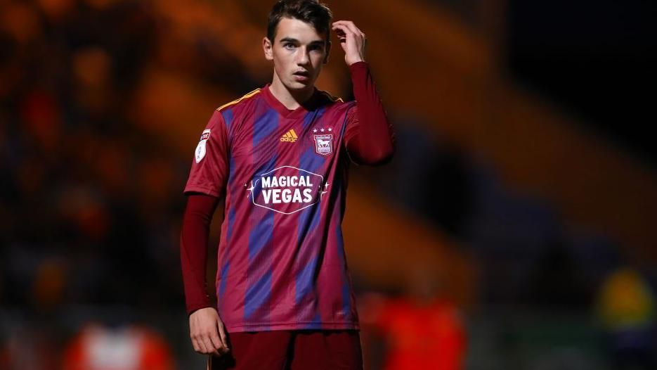 Norwich City midfielder Liam Gibbs playing in an Ipswich Town kit 