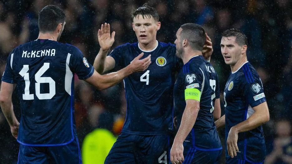 Scott McTominay is congratulated by his Scotland teammates