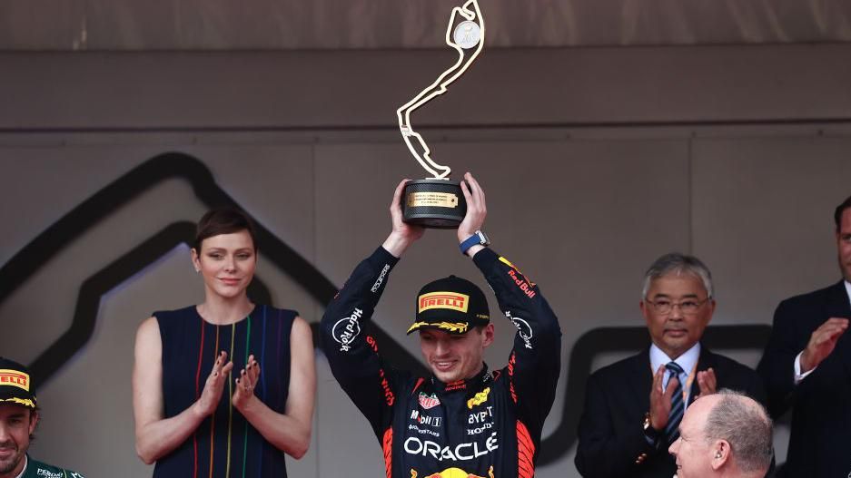 Max Verstappen lifts the Monaco GP trophy in 2023