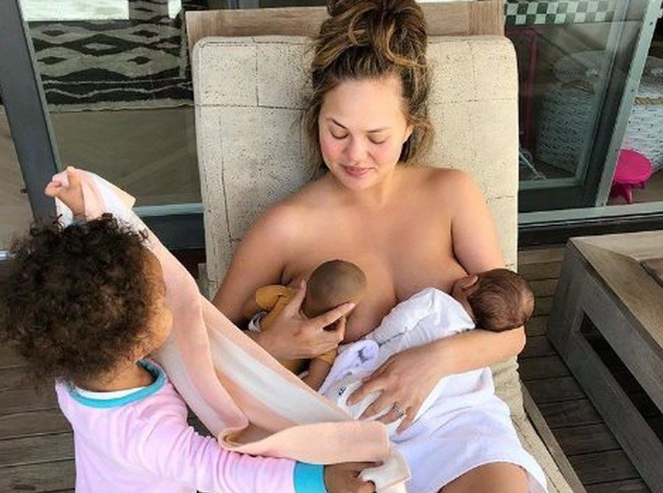 Megan breastfeeds her baby, and her daughter's doll at the same time