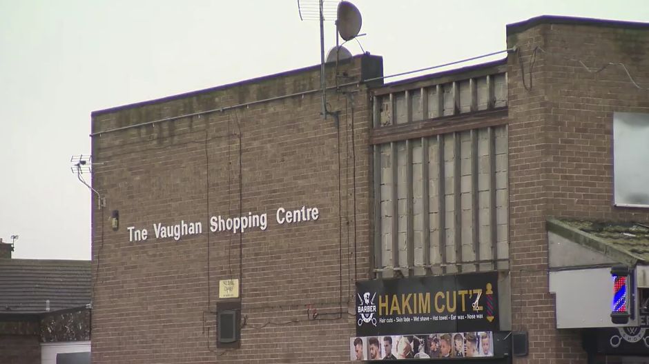 A brick built building with a sign saying The Vaughan Shopping Centre 