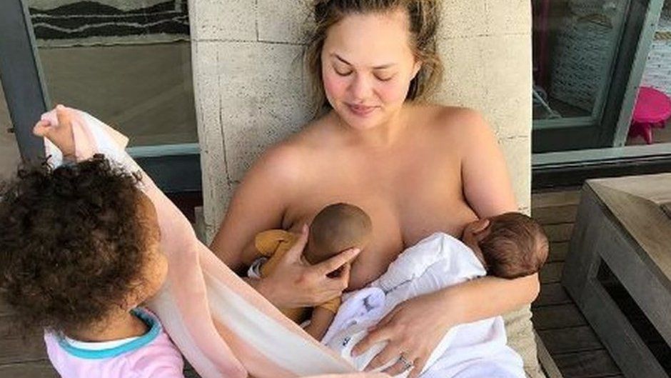 Megan breastfeeds her baby, and her daughter's doll at the same time