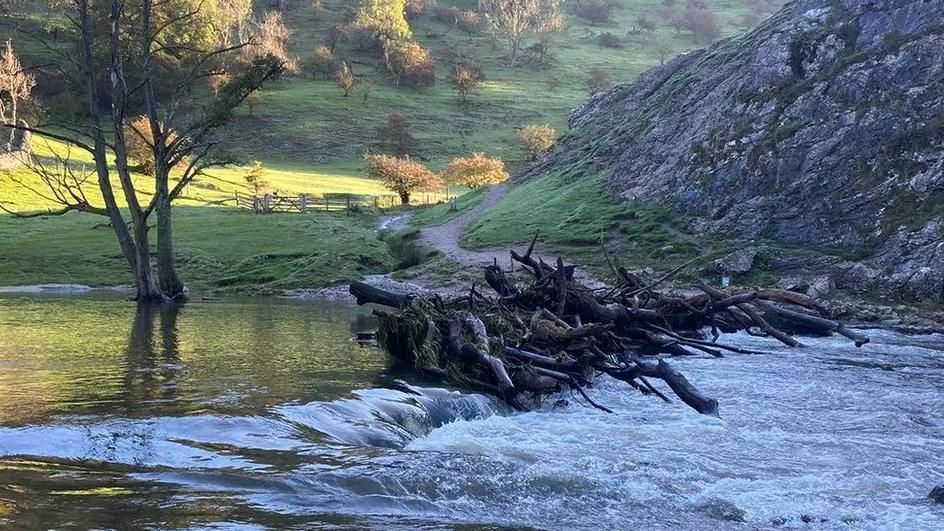 Dovedale's stepping stones obscured by water and debris