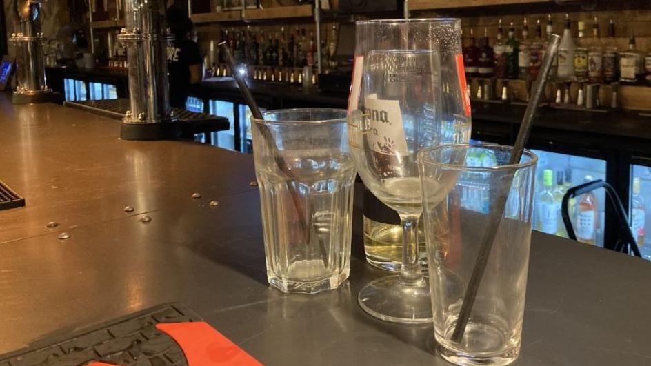 Empty glasses on a bar