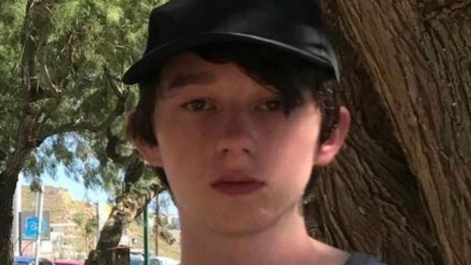 Victor, a boy with dark hair wearing a dark hat