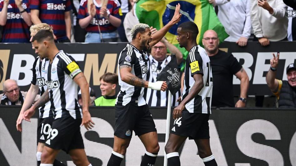 Newcastle's Joelinton celebrating his goal alongside Alexander Isak