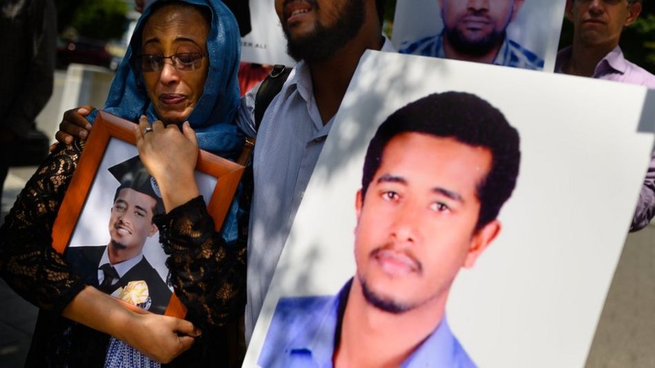 Siblings Zinet Adem, 45, of Beltsville, MD left, and Beza Alemu, 32, of St. Louis, mourn the loss of their brother, Mulusew Alemu, 36.