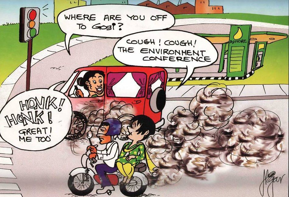 Comic showing Gogi on a motorcycle, speaking to a woman driving a van beside her which is emitting lots of fumes. The woman asks: "Where are you off to Gogi?". Gogi replies: "Cough! Cough! The environment conference". The woman replies: "Honk! Honk! Great! Me too".