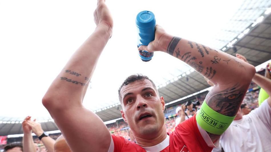 Granit Xhaka celebrates after Switzerland's last 16 win against Italy