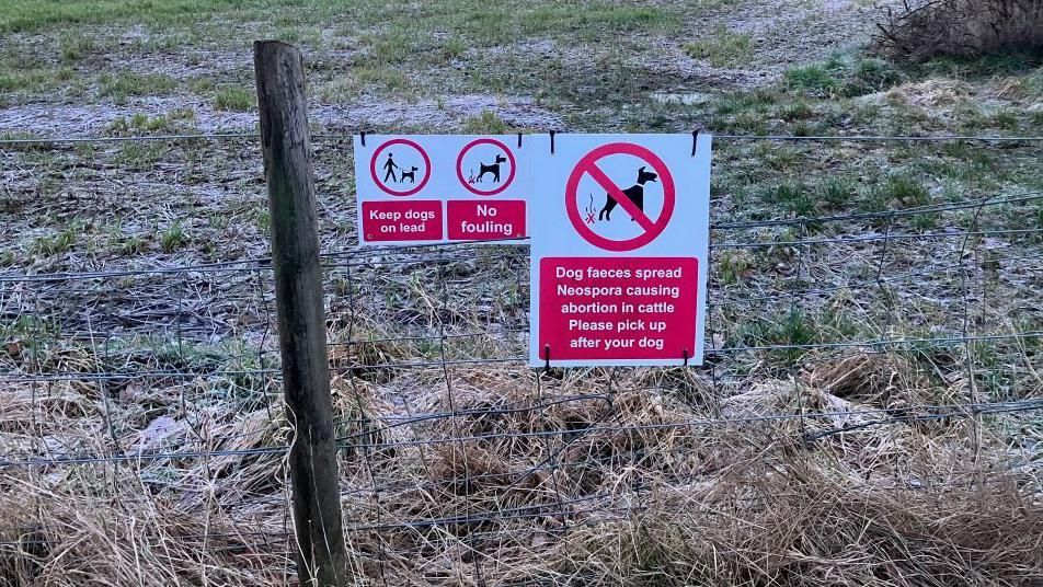 Warning signs at a field in Inverness