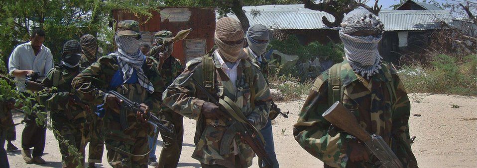 file photo taken on March 5, 2012 shows Al-Qaeda linked al-Shebab recruits walking down a street in the Deniile district of the Somalian capital, Mogadishu