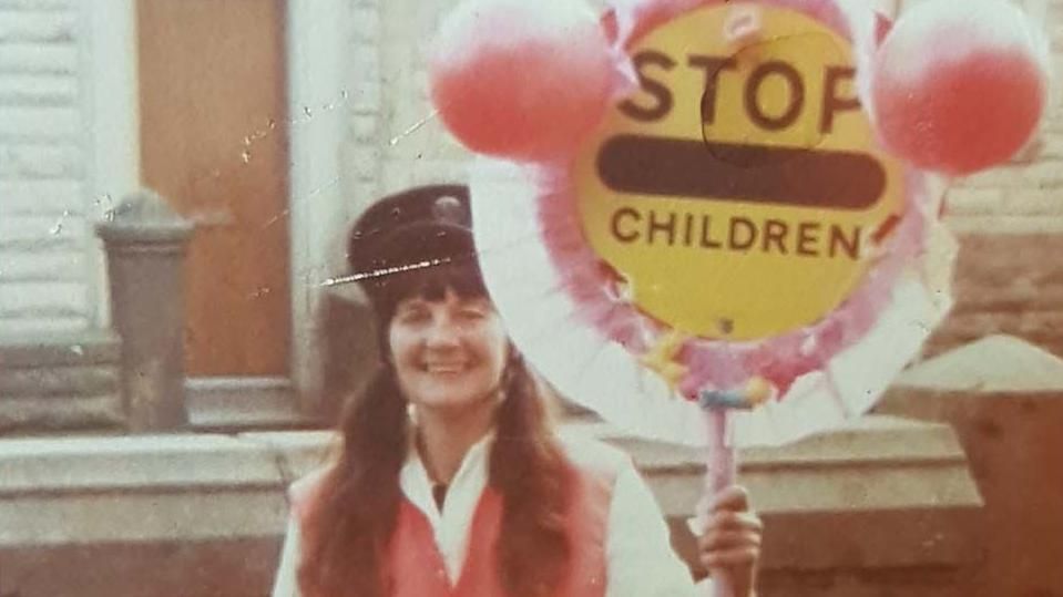 Irene Reid in the early days of her career holding a lollipop stick