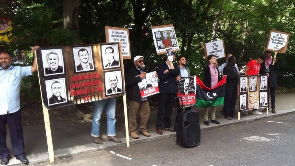 Salman Abedi (far right in red) listening to Taher Nasuf at a demonstration in London