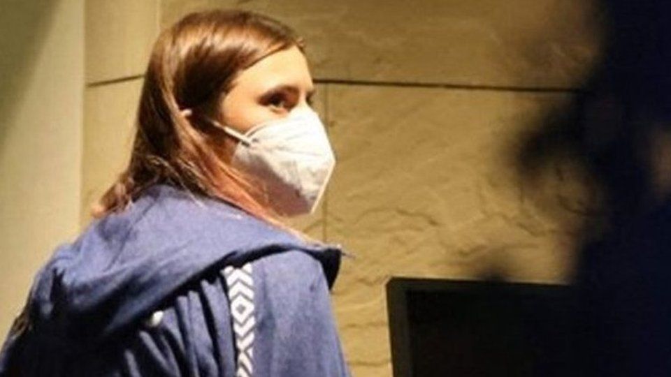 Krystina Timanovskaya walks with her luggage inside the Polish embassy in Tokyo