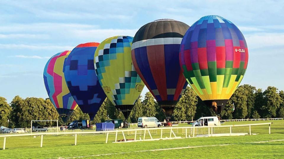 Five hot air balloons prior to take off