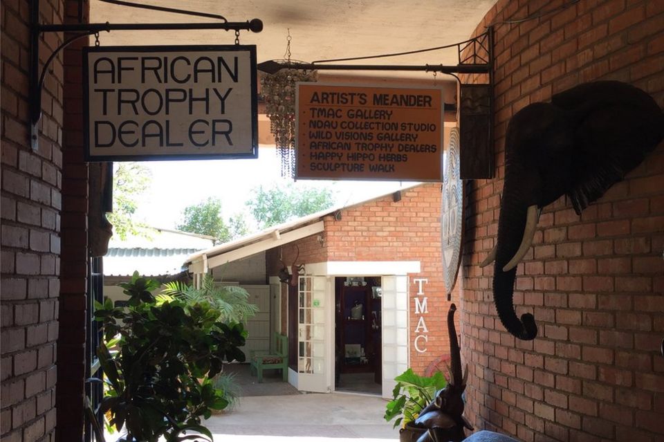 A trophy hunting company welcomes customers in Victoria Falls, Zimbabwe