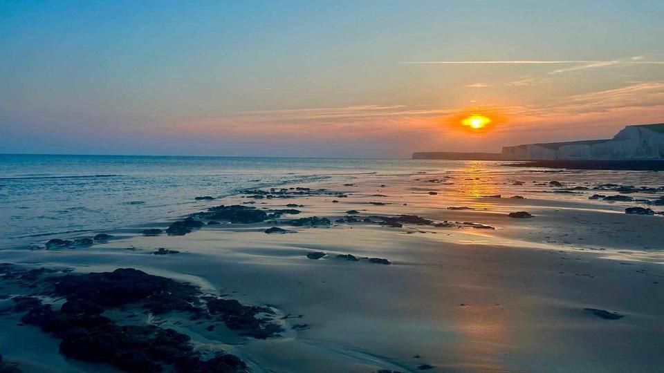 A sunset over a beach 