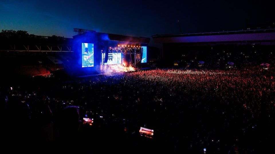 Kings of Leon at Ashton Gate with the stadium shown at night with thousands of people on the pitch
