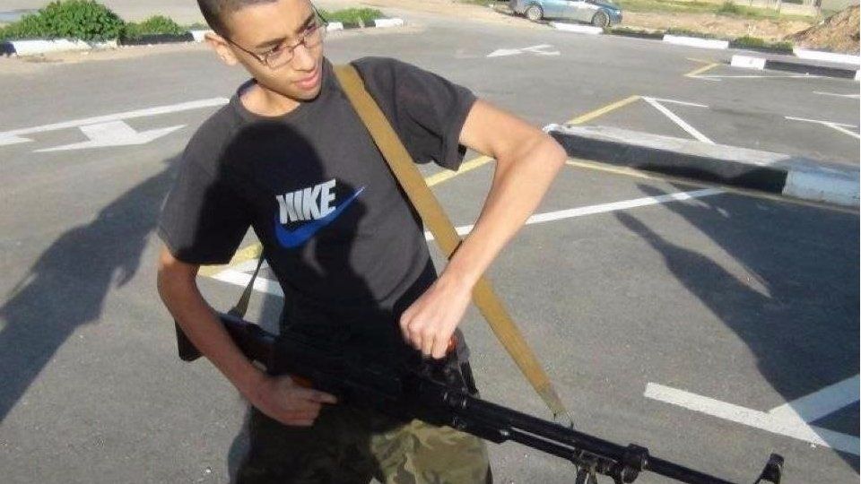 An image from Hashem Abedi's Facebook page shows him brandishing a large gun