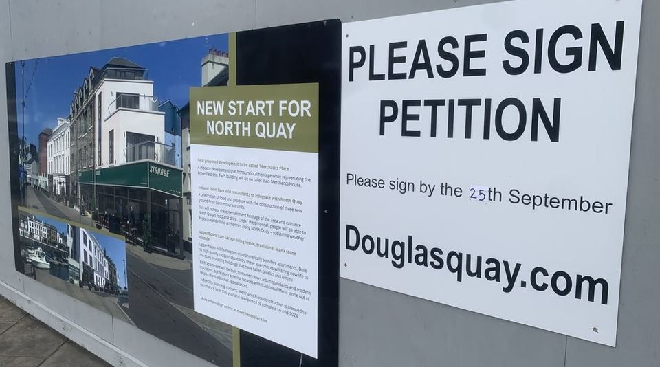 Picture of proposed development and sign calling for people to sign a petition