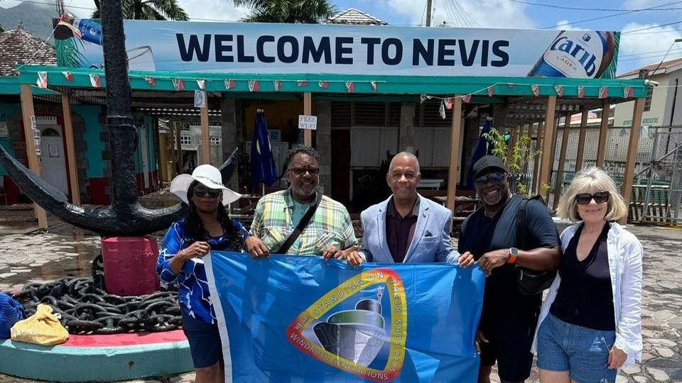 Nigel Guy MBE (second from left) and Charles Dacres (second from right) in Nevis 
