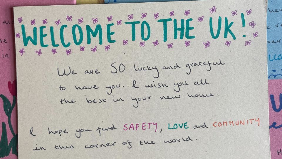 A handwritten letter wishing a newly arrived person in the UK all the best for the future.