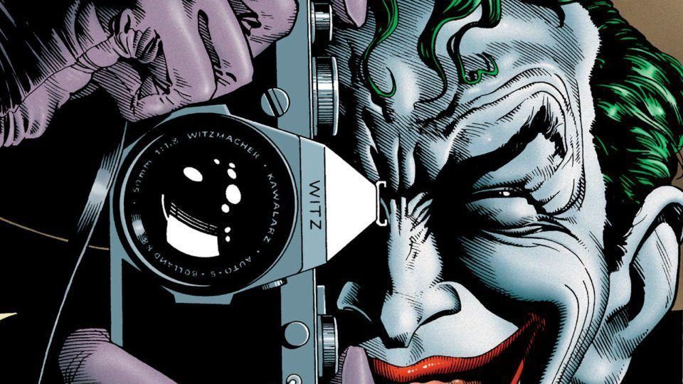 The Joker holding a camera to his face 