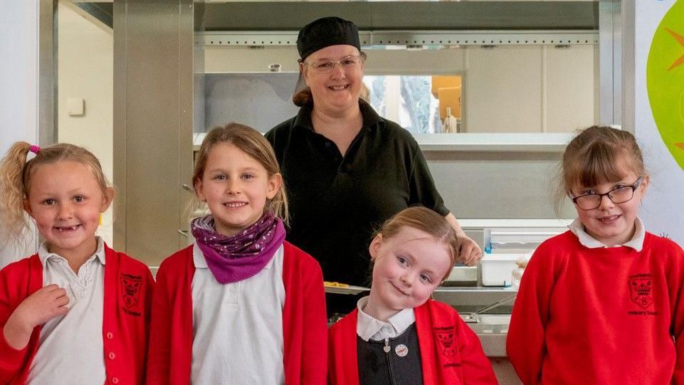 Pupils of Southwold Primary School with their Head of Kitchen Zoe Dawkins