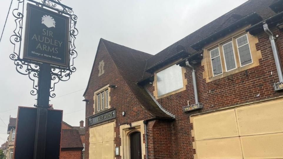 The Sir Audley Arms pub boarded up