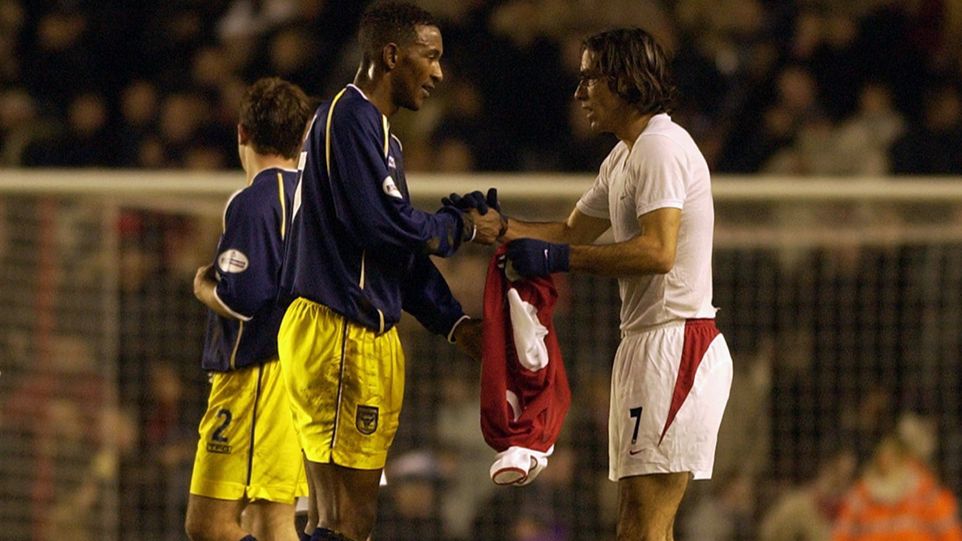 Jefferson Louis receives Robert Pires' shirt after Oxford United's FA Cup tie with Arsenal in 2003