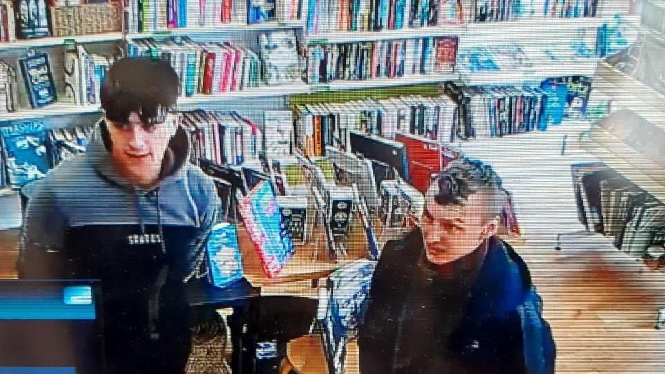 Two men in book shop