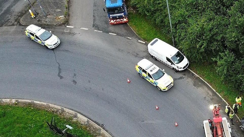 An aerial shot of police vehicles on a roundabout on the A140 in Norfolk