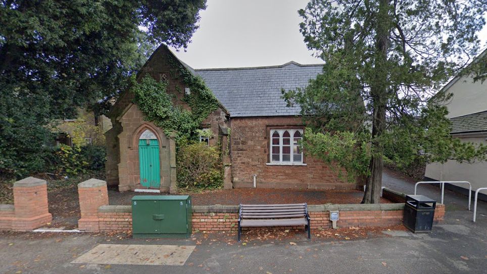 Google external view of the Northfield Centre, a small brick building with a green door