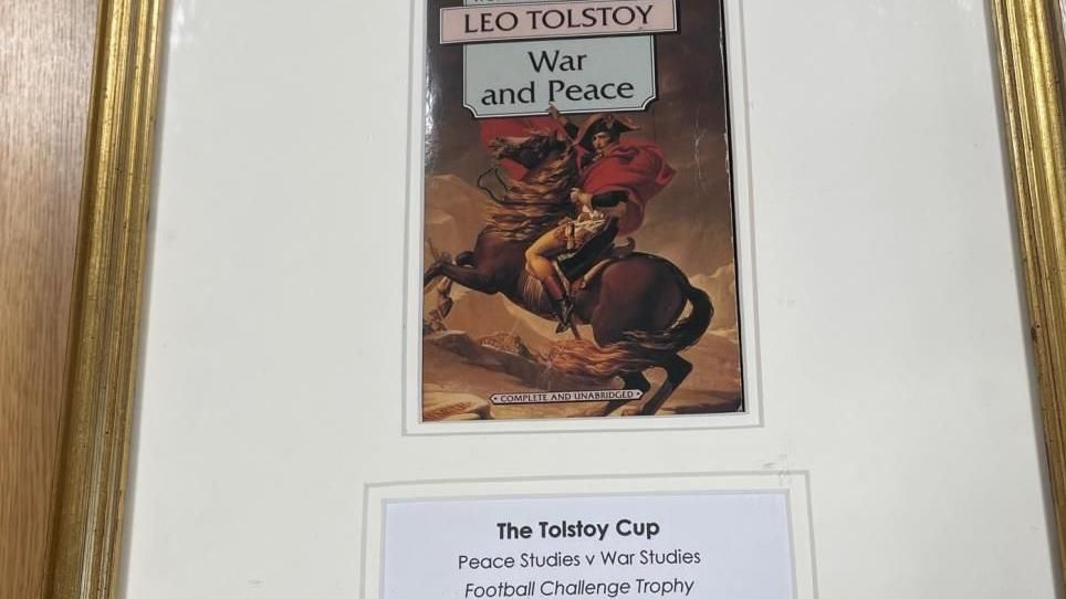 An image of Tolstoy Cup trophy featuring the book cover of Leo Tolstoy's War and Peace