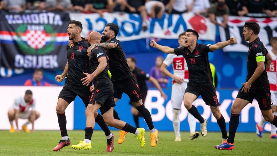 Albania players celebrate scoring the late equaliser against Croatia