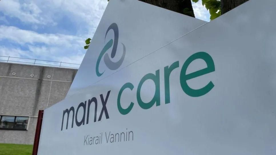 A close up of the Manx Care sign