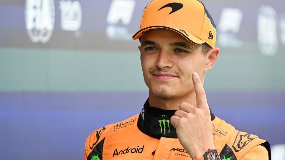 Lando Norris celebrates taking pole position for the Spanish Grand Prix by holding up his index finger