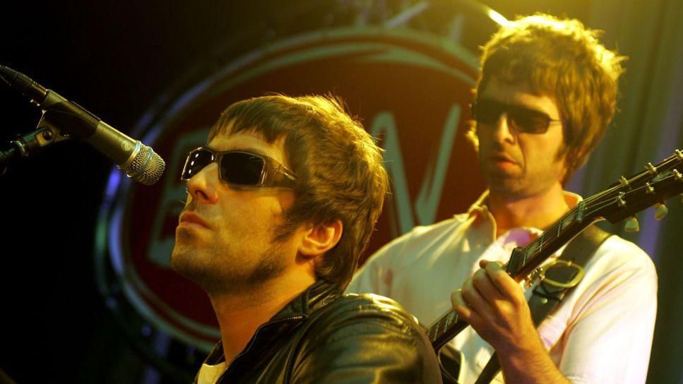 Liam and Noel Gallagher performing in 2001