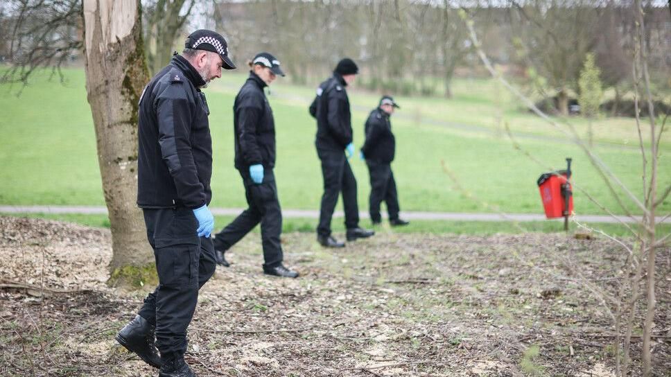 Police officers were seen searching the local woodland areas