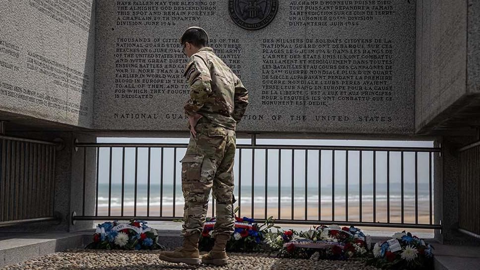 A US Ranger visits a memorial in Omaha Beach