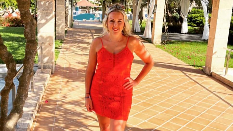 Rachel Smith standing on a sunny path on holiday