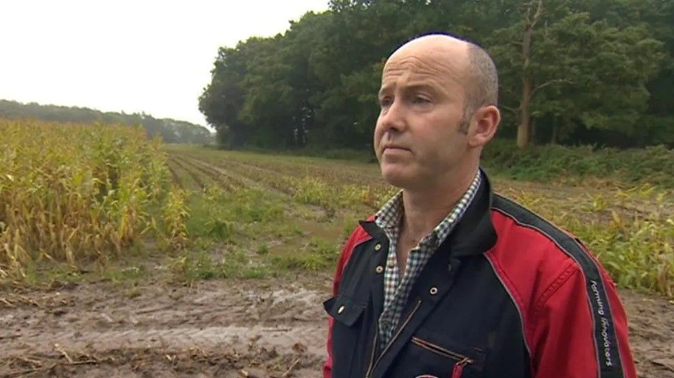 Charles Goadby standing on a field at his farm