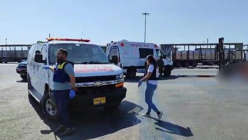 An ambulance is seen near the crossing