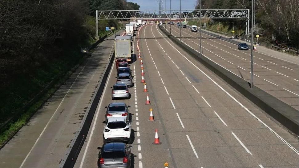 A line of traffic on the approach to the road closure