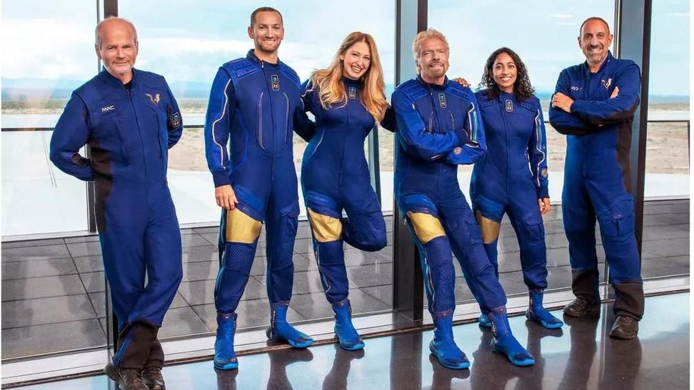 Colin Bennett, second from left, in his blue work uniform with his colleagues