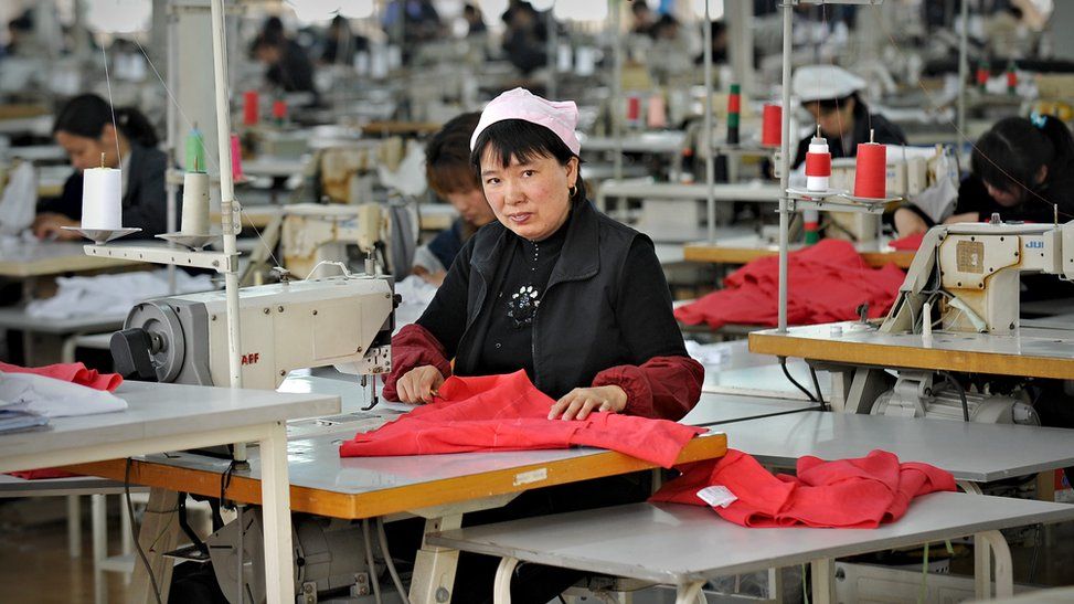 A woman works at a garment factory in China in 2010